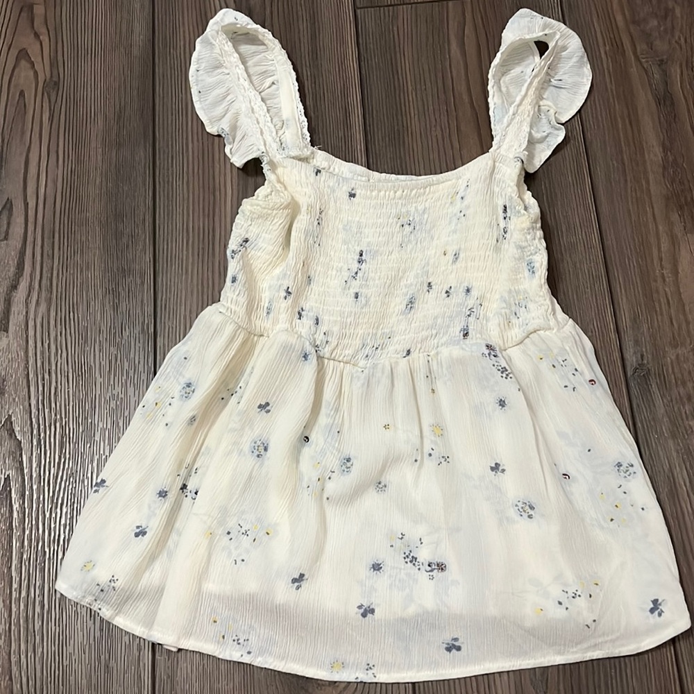 White baby doll top with blue flowers. Size XS from Francesca’s